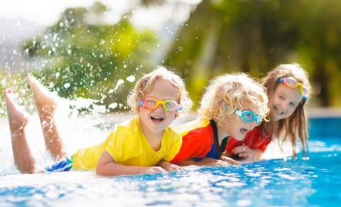 children playing in pool