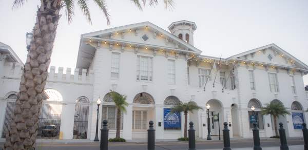 Exterior of the History Museum of Mobile and a palm tree