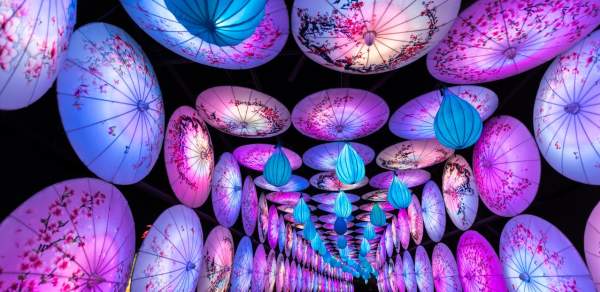 Tunnel created by hanging umbrella lanterns