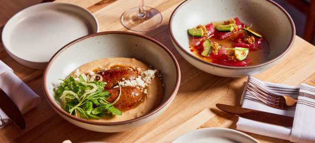 A table with food at Alma Fonda Fina in Denver, Colorado.