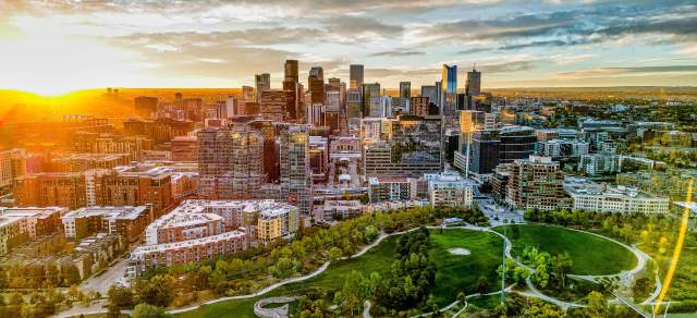 An aerial view of the Denver, Colorado, skyline during sunrise.