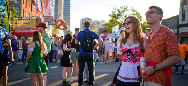 A couple enjoys live music at Denver Oktoberfest.