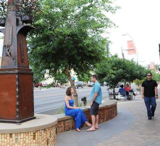 People Sitting On Downtown Chandler's Tree-lined Walkways