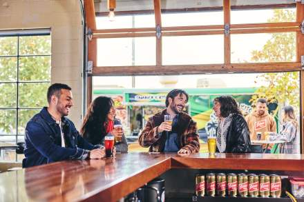 Friends drinking at Fisher Brewing