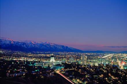 City lights view of the Utah Capitol Building and Salt Lake valley. Dusk sky with mountains in the background