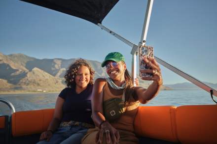 Mother and daughter taking a selfie on a boat tour of the Great Salt Lake.