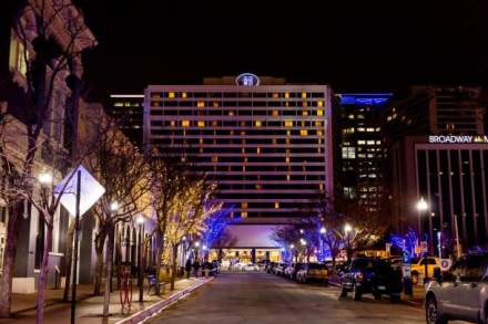 Nightime view looking down Broadway street toward the Hilton Salt Lake City Center