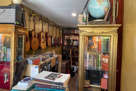 Shelves of second-hand books and guitars pepper the walls at 9th & 9th Book and Music Gallery.