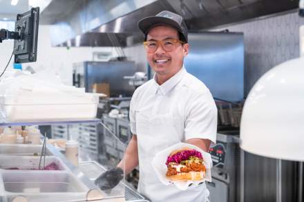 Viet Pham shows off one of his delicious chicken sandwich creations