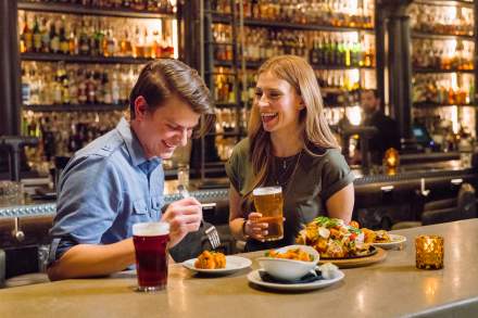 Couple eating at bar at Lake Effect