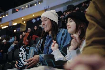 Woman watching the Utah Mammoth at the Delta Center.
