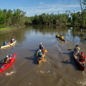 group paddling along the red river of the north