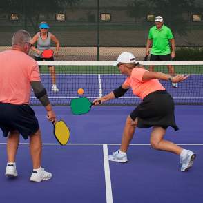 2 couples playing pickleball