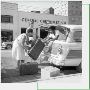 Green Book women loading car
