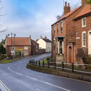 A quiet street in Caistor with houses and road going through the centre