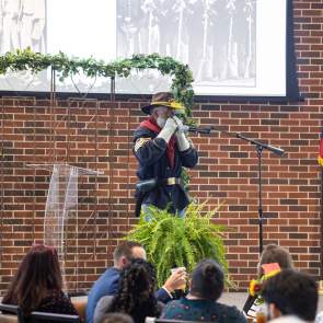 Buffalo soldier playing the horn at the Juneteenth luncheon