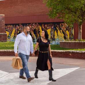 A couple walking at Pat Coursey Park