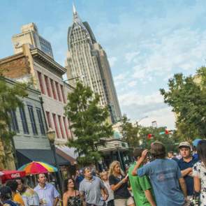 group of people walking in the street downtown