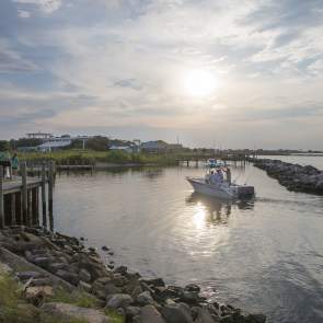 Small boat coasting on the waters of Dauphin Island