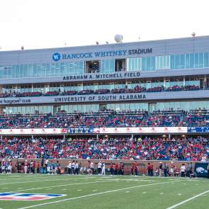 Whitney Stadium Football field with fans in the stands