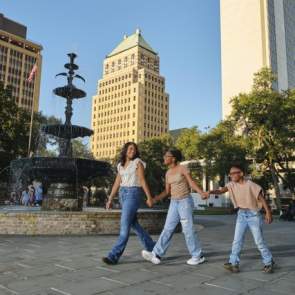 People walking in Irving near fountain