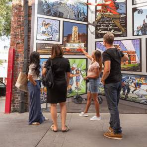 Group of professional looking at downtwon mural