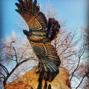 Bird with wings open sculpture