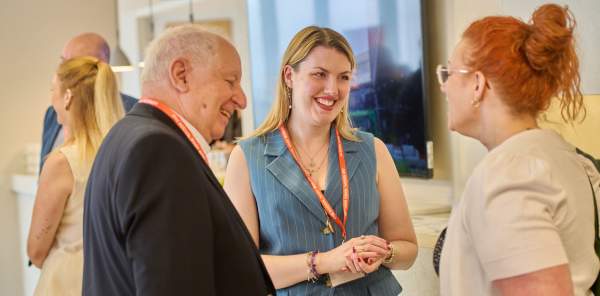 A member of the West Midlands Growth Company team networks with partners at an event.