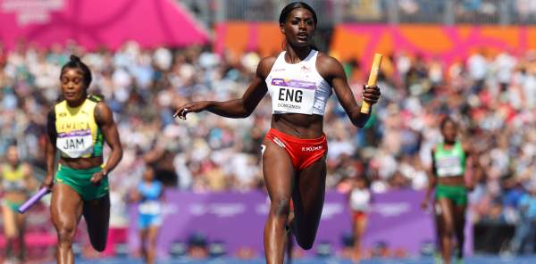 Three women runners in relay