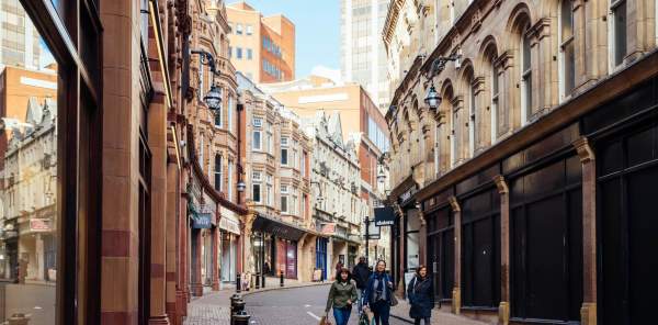 A view along Canon Street, with shops on either side, during the day