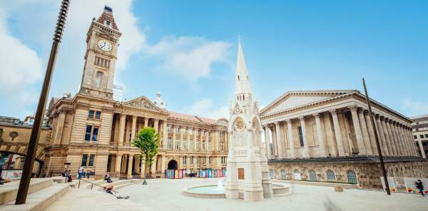 The clock tower in Chamberlain Square on a sunny day
