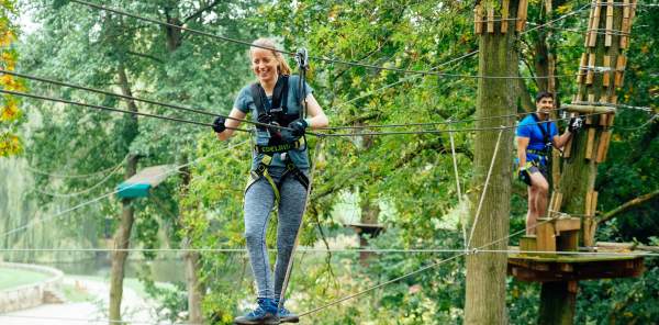 A woman on some high wires at Go Ape Coventry