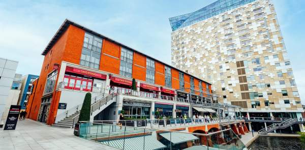 Restaurants along the waterfront by the Mailbox with the Cube in the background