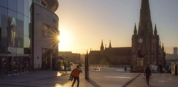 A sunrise in Birmingham city centre, overlooking St Martin in the Bullring church and Bullring shopping centre