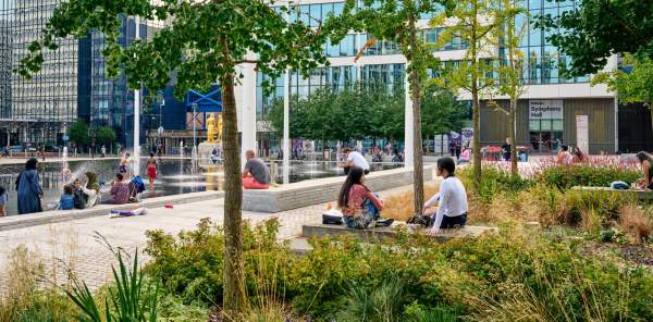 Greenery flourishing in an urban area of Birmingham, with people enjoying the natural plant life