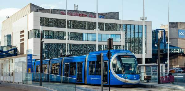 A West Midlands tram infront of Symphony Hall and the ICC