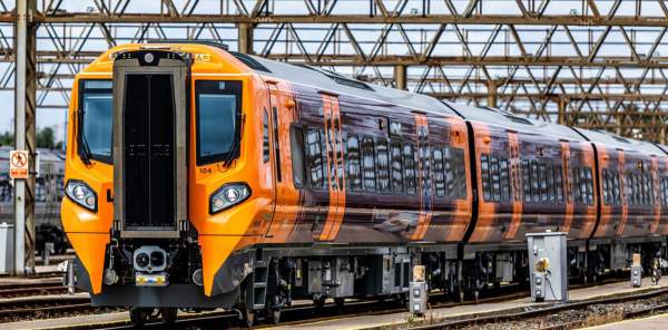 West Midlands Trains Class 196 train in orange and purple livery