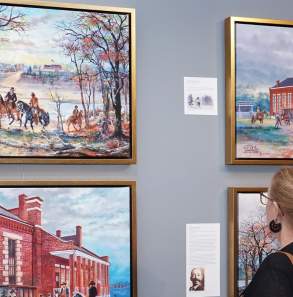 Women viewing John Bell paintings