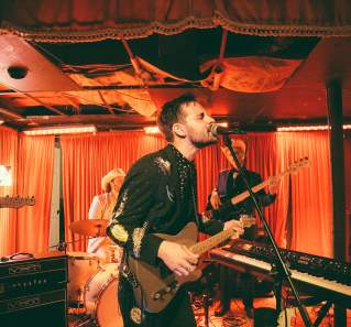 Robert Ellis and band playing live music at the White Horse during Hot Luck Live Food & Music Festival in Austin Texas