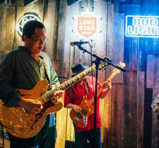 Band on stage at Rustic Tap bar on west sixth street in austin texas