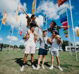 group of people in front of flags at ACL Austin City Limits Music Festival in austin texas