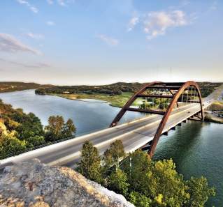 View of Lake Austin and 360 Bridge from the scenic overlook, also showcasing downtown and Hill Country veiws.