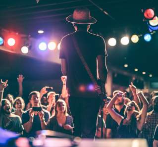 Gary Clark Junior on stage at Antones with guitar