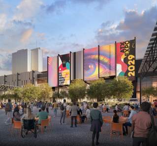 Austin Convention Center rendering shows the outdoor event space with attendees in the foreground looking towards a large screen showcasing ATX Expo 2029 signage on the north side of the building. The Fairmont hotel is in the background and the space includes trees and greenery in front of the building.