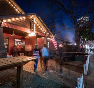 exterior of Bangers Sausage House and Beer Garden at night on rainey street in austin texas