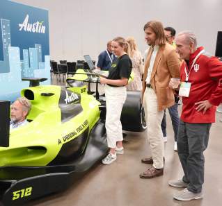 Image of the Austin Sports Commissions F1 Simulator in use at the ASCM Conference.