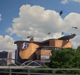 We Can Be Heroes screengrab showing helicopters flying over the Heroes Headquarters. Large white clouds dot the blue sky