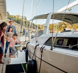 family gets on boat at lakeway resort in austin texas