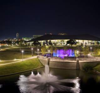 Palmer Event Center and fountains at night