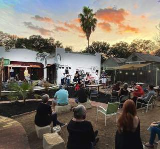 Rio Social House patio with live music at sunset in Smithville Texas